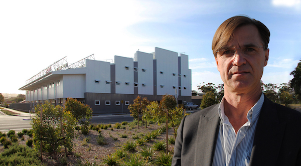 Roger Davies in front of Fluid Solar House