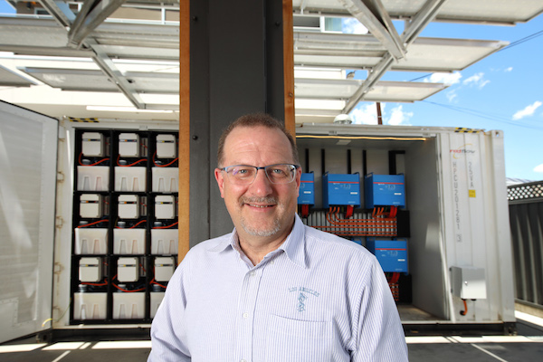 Simon Hackett in front of the redesigned LSB (Large Scale Battery) at Base64 in Adelaide